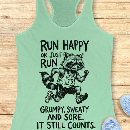 mint tank top with text - run happy or just run grumpy, sweaty and sore. it still counts.  on a wooden background