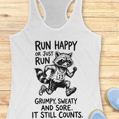 white tank top with text - run happy or just run grumpy, sweaty and sore. it still counts.  on a wooden background