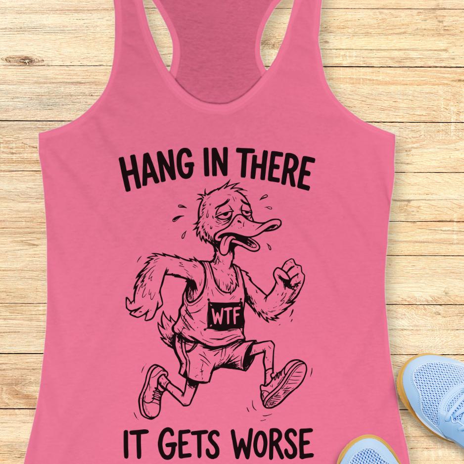 pink tank top with an image of a duck and text "hang in there it gets worse" on a wooden background