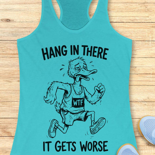 blue tank top with an image of a duck and text "hang in there it gets worse" on a wooden background