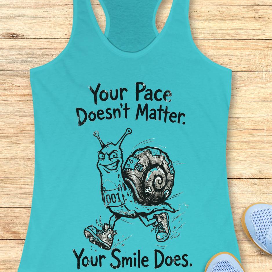 blue tank top with an image of a running snail , smiling, and text - "your pace doesn't matter. Your smile does." on a wooden background