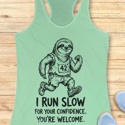 mint tank top with an image of a sloth running and text - "i run slow for your confidence. you're welcome." on wooden background