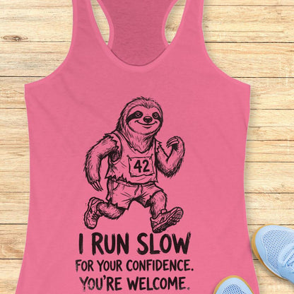 pink tank top with an image of a sloth running and text - "i run slow for your confidence. you're welcome." on wooden background