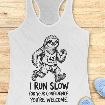 white tank top with an image of a sloth running and text - "i run slow for your confidence. you're welcome." on wooden background
