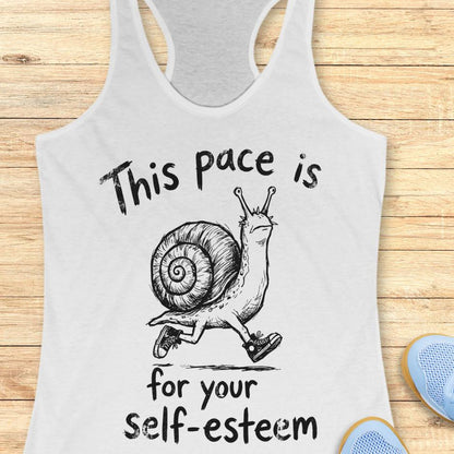 white tank top with a runner snail and text - this pace is for your self esteem. on a wooden background