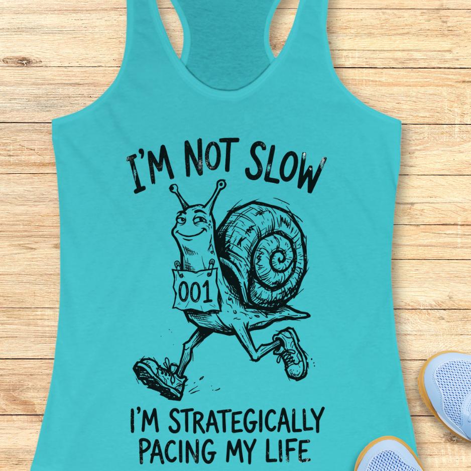 blue tank top with a running snail and text - I'm not slow I'm strategically pacing my life on a wooden background