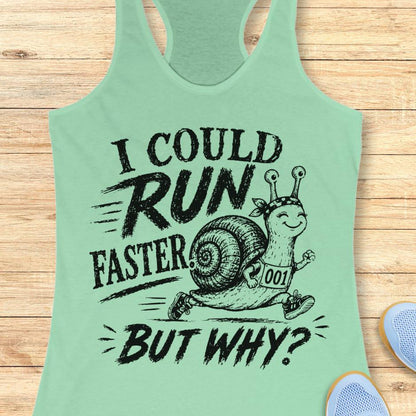 mint tank top with a running snail and text - I could run faster. but why?  on a wooden background