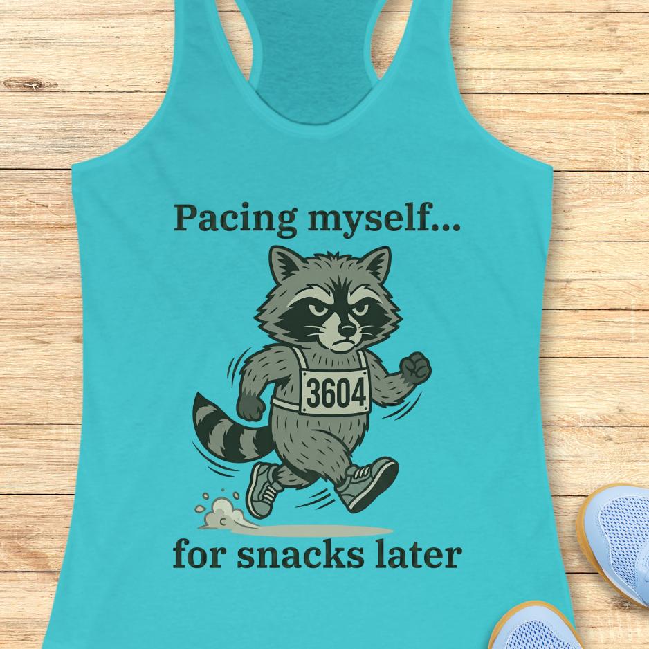 blue tank top with a running raccoon and text "pacing myself...for snacks later" on a wooden background