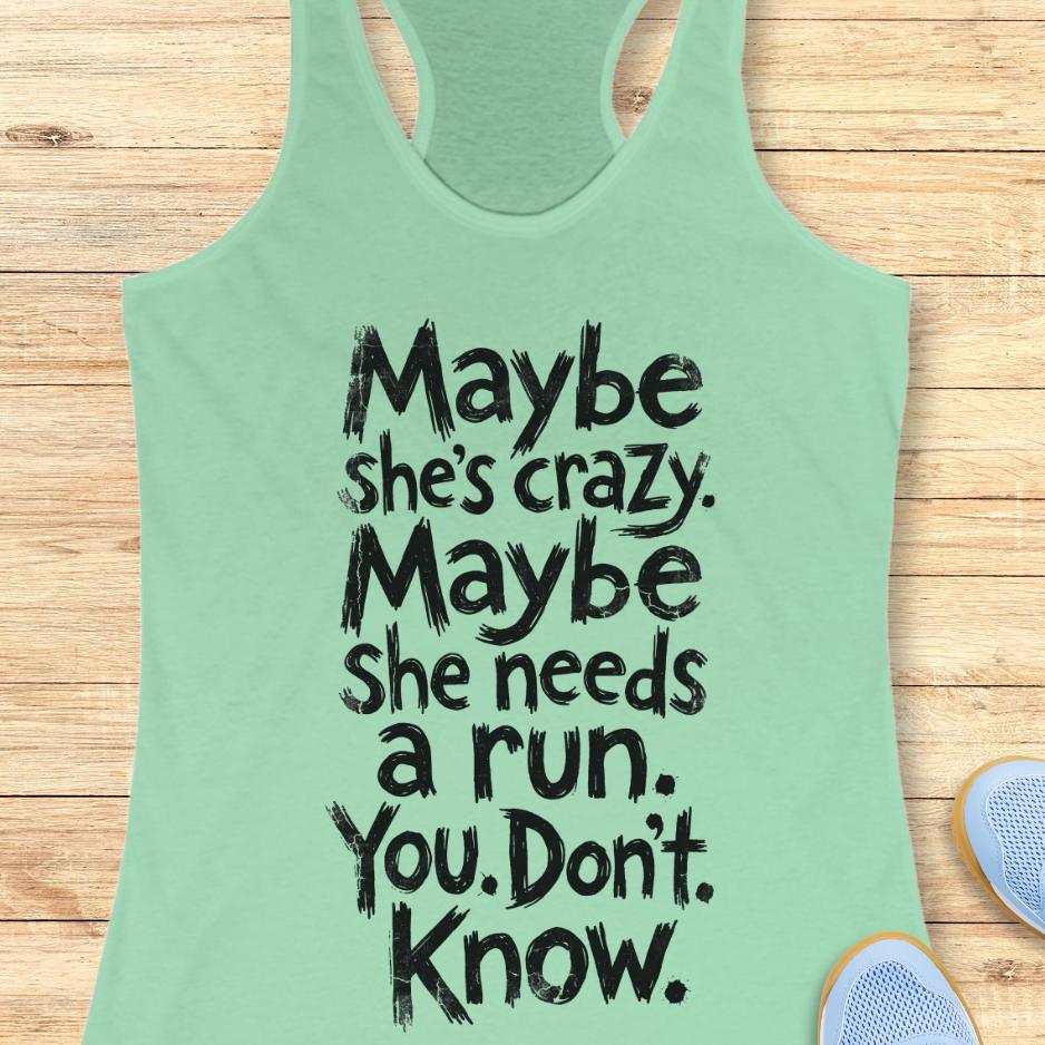 mint tank top with text - maybe she's crazy. Maybe she needs a run. You. Don't. Know.  on a wooden background