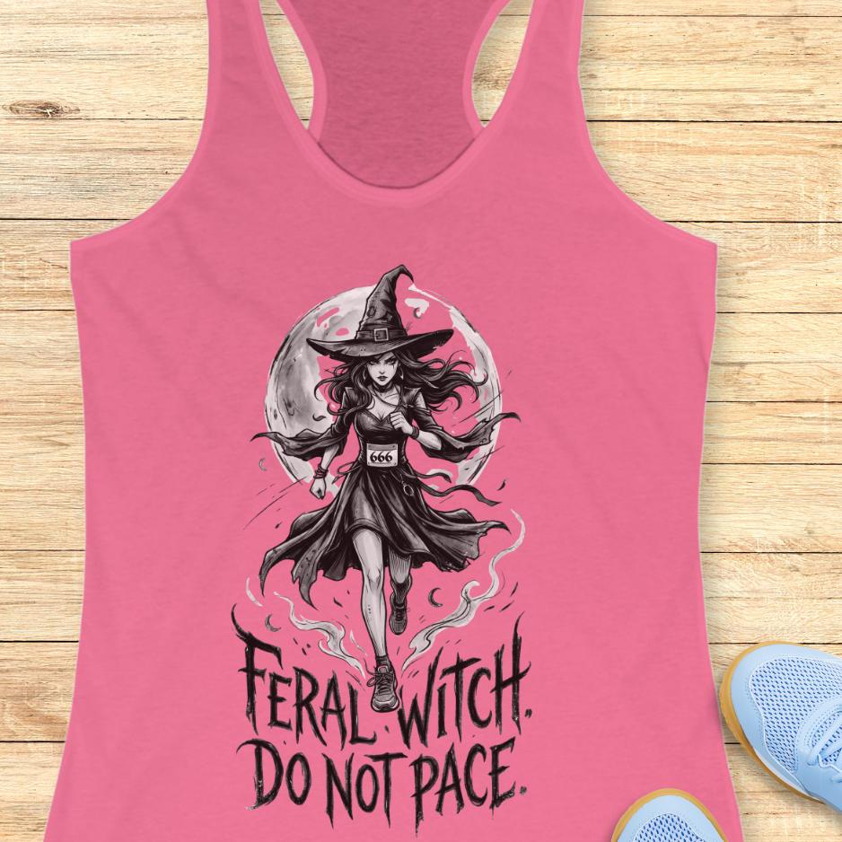 pink tank top with an image of a running witch and the text - feral witch. Do not pace. on a wooden background