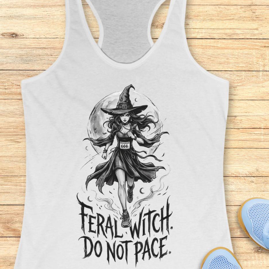 white tank top with an image of a running witch and the text - feral witch. Do not pace. on a wooden background
