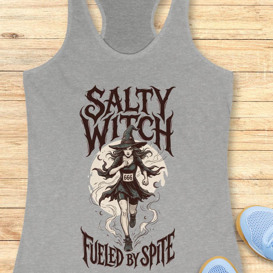 grey tank top with an image of a running witch and the text - salty witch. Fueled by spite. on a wooden background