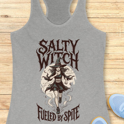 grey tank top with an image of a running witch and the text - salty witch. Fueled by spite. on a wooden background