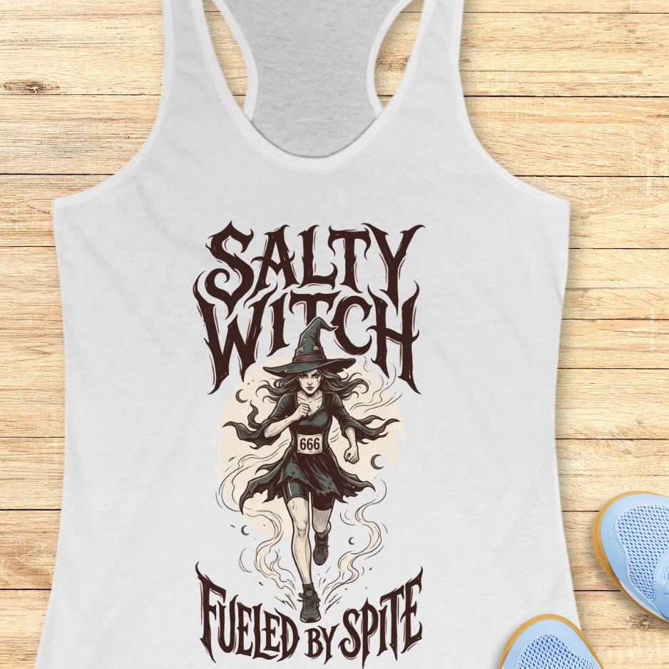 white tank top with an image of a running witch and the text - salty witch. Fueled by spite. on a wooden background