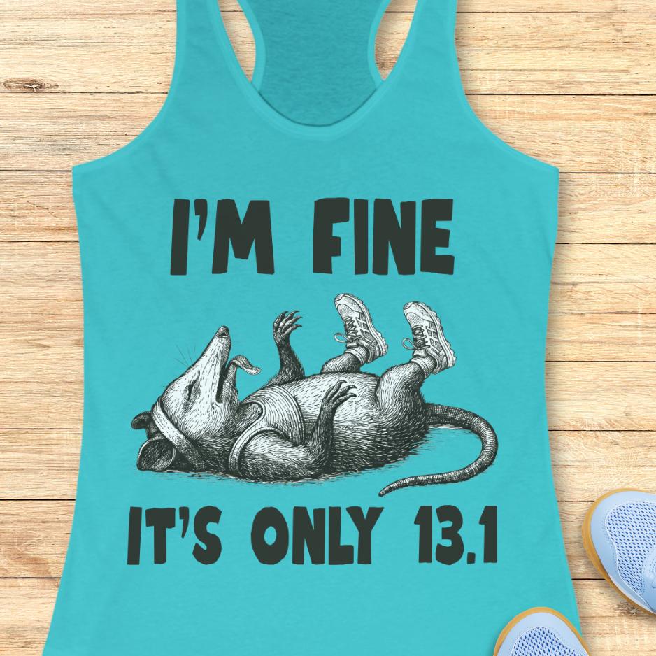 Turquoise tank top with a graphic of a rat and text 'I'm fine it's only 13.1' on a wooden surface.