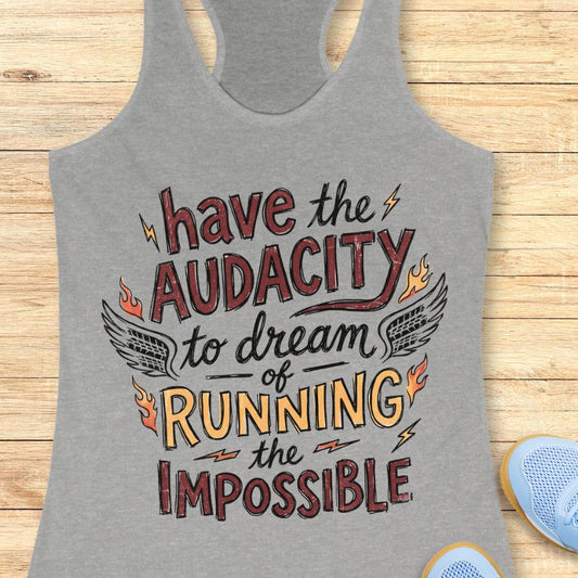 grey tank top with the text - have the audacity to dream of running the impossible , on a wooden background