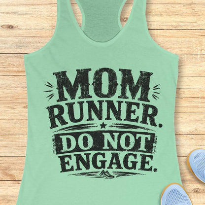 mint tank top with the text - mom runner. do not engage. on a wooden background