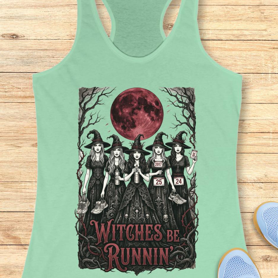 mint tank top with an image of 5 running witches , bloody moon and text - witches be runnin', on a wooden background