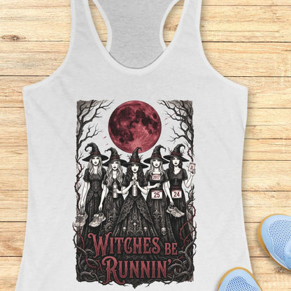 white tank top with an image of 5 running witches , bloody moon and text - witches be runnin', on a wooden background