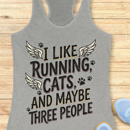 Gray tank top with text 'I like running, cats, and maybe three people' on a wooden surface