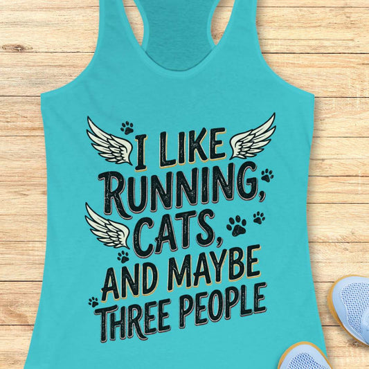 Turquoise tank top with text 'I like running, cats, and maybe three people' on a wooden surface.