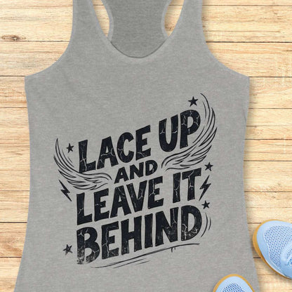 Gray tank top with 'Lace Up and Leave It Behind' text on a wooden surface