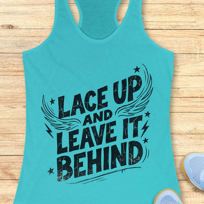 Turquoise tank top with 'Lace Up and Leave It Behind' text on a wooden surface