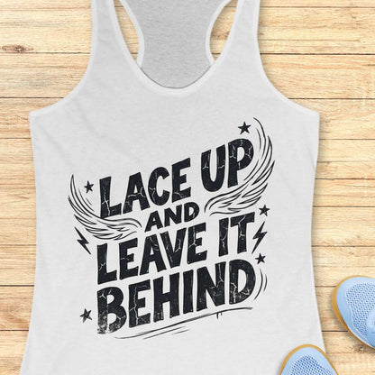 white tank top with 'Lace Up and Leave It Behind' text on a wooden surface