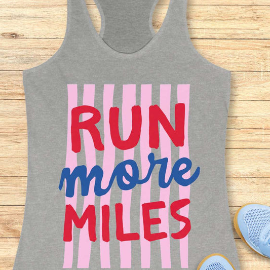 Gray tank top with 'RUN more MILES' text on a wooden surface