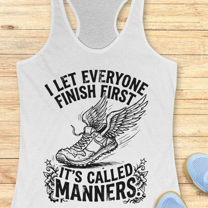 White tank top with black graphic and text on a wooden surface