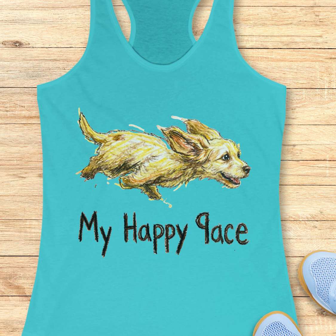 Turquoise tank top with a dog illustration and 'My Happy Pace' text on a wooden surface.
