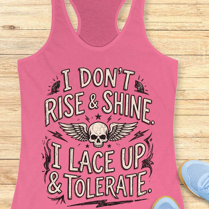 Pink tank top with skull design and text on a wooden surface