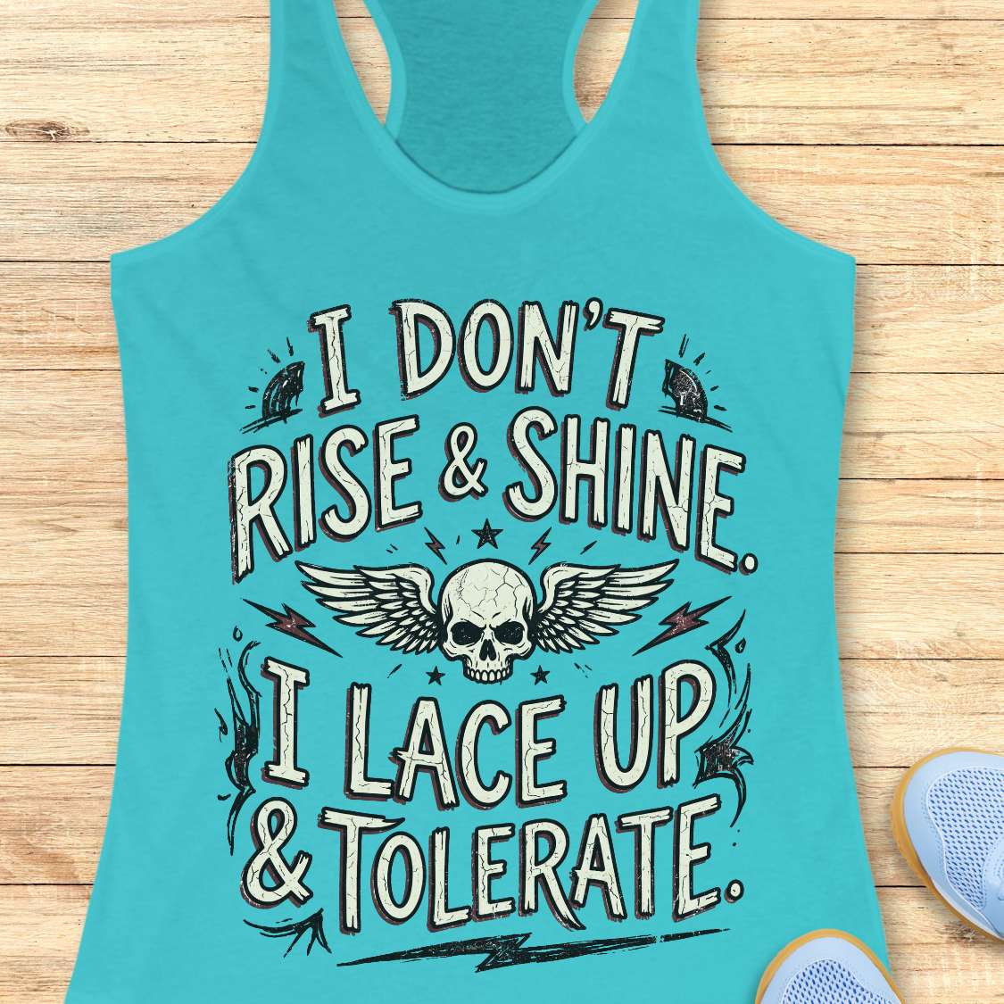 Turquoise tank top with skull design and text on a wooden surface