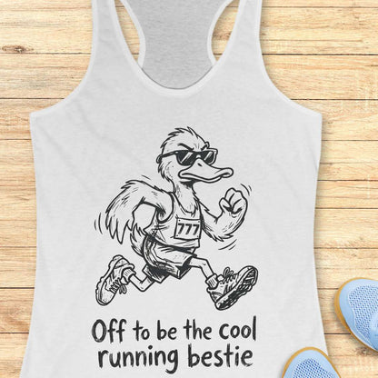 white tank top with a cartoon ostrich running and sunglasses on, text 'Off to be the cool running bestie' on a wooden surface.