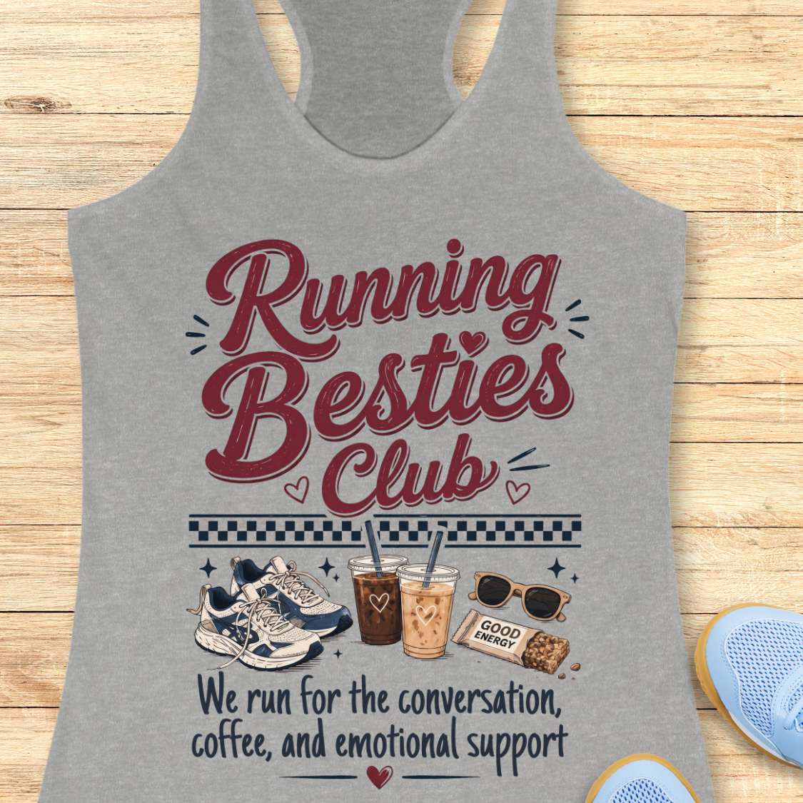Gray tank top with 'Running Besties Club' text and graphics on a wooden surface