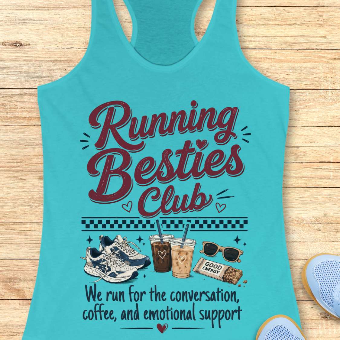 Turquoise tank top with 'Running Besties Club' text and graphics on a wooden surface