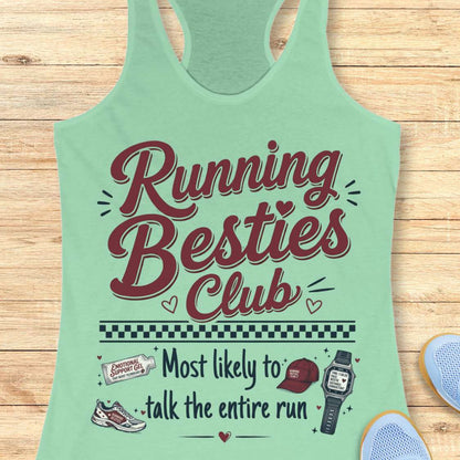 Mint green tank top with 'Running Besties Club' text and graphics on a wooden surface.