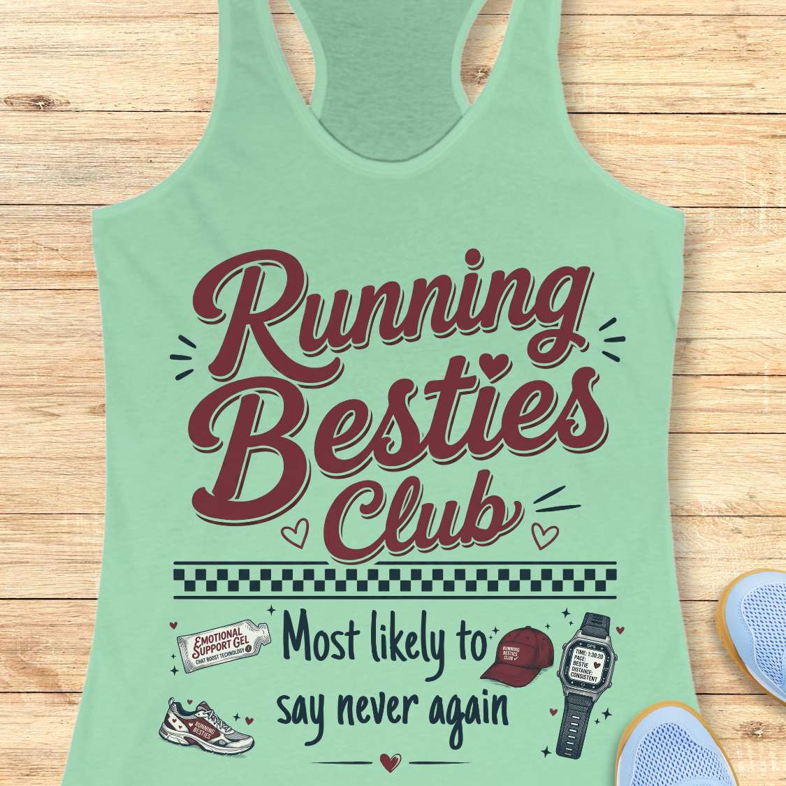 Mint green tank top with 'Running Besties Club' text on a wooden surface