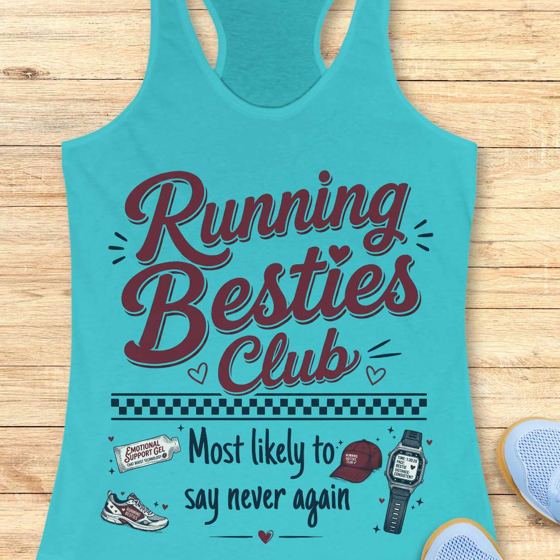 Turquoise tank top with 'Running Besties Club' text and graphics on a wooden surface