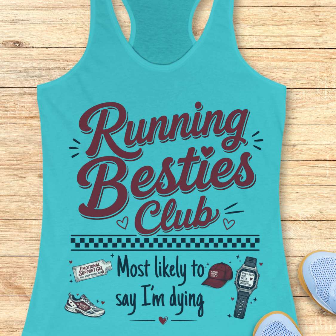 Turquoise tank top with 'Running Besties Club' text and graphics on a wooden surface.