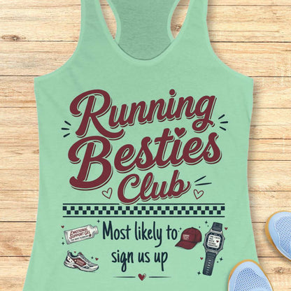 Light green tank top with 'Running Besties Club' text and graphics on a wooden surface