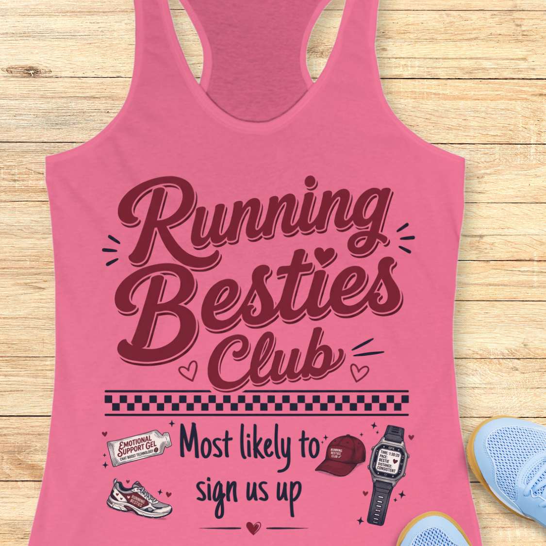 Pink tank top with 'Running Besties Club' text on a wooden surface