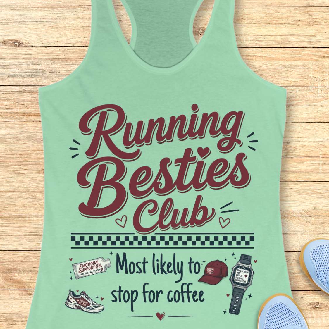 Mint green tank top with 'Running Besties Club' text and graphics on a wooden surface