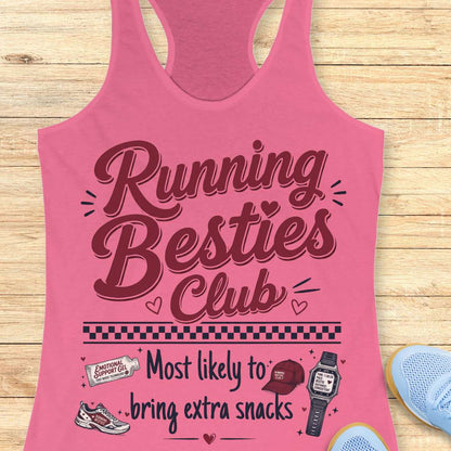 Pink tank top with 'Running Besties Club' text and graphics on a wooden surface.