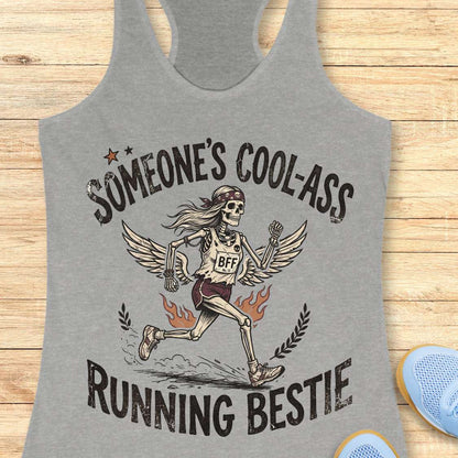 Gray tank top with skeleton design and text on a wooden surface
