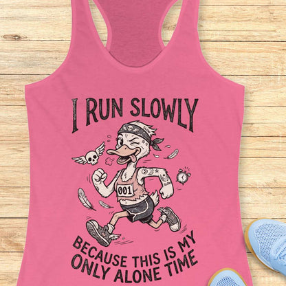 Pink tank top with cartoon character and text - I run slowly, because this is my only alone time, on a wooden surface