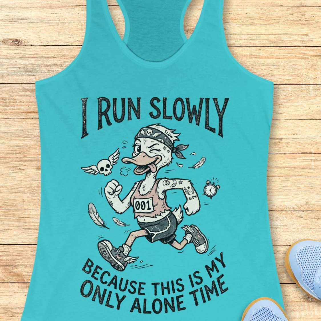 Turquoise tank top with cartoon character and text - I run slowly, because this is my only alone time, on a wooden surface