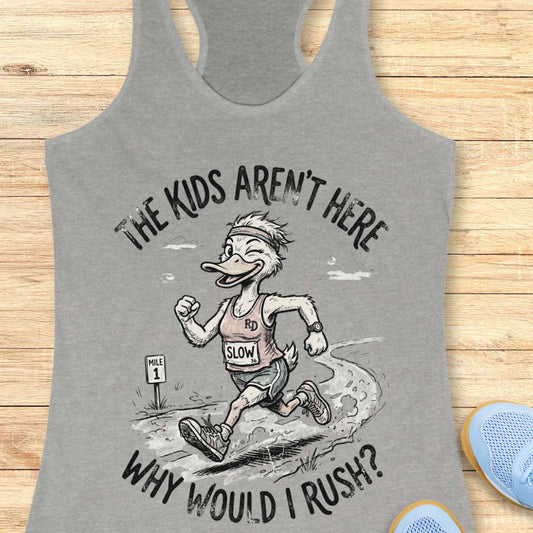Gray tank top with cartoon character and text - the kids aren't here, why would I rush?, on a wooden surface