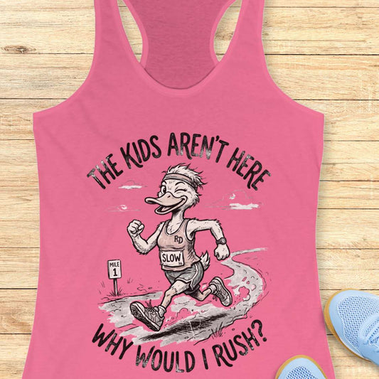 Pink tank top with cartoon character and text - the kids aren't here, why would I rush?, on a wooden surface