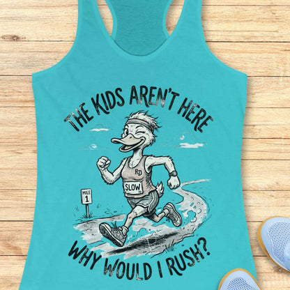 Turquoise tank top with cartoon character and text - the kids aren't here, why would I rush?, on a wooden surface
